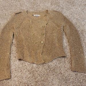Gold Jennifer Lopez sweater